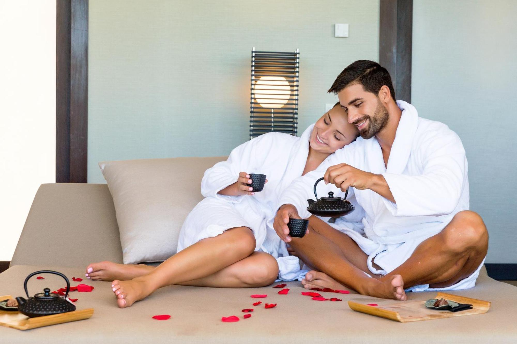 Epic Sana Algarve Hotel Albufeira Bagian luar foto A couple wearing bathrobes